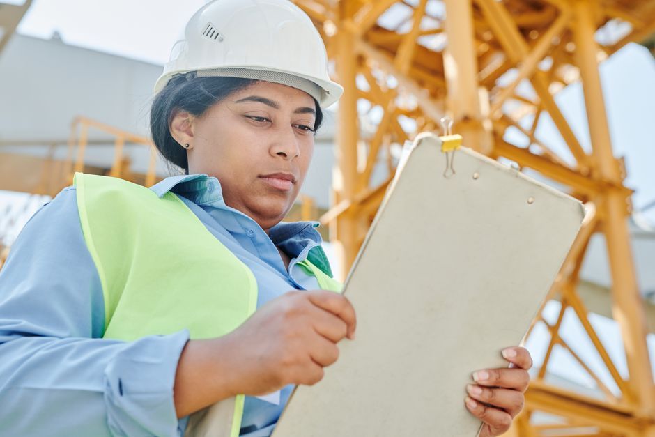 Safety auditor consultant inspecting a facility against ISO 45001 standards