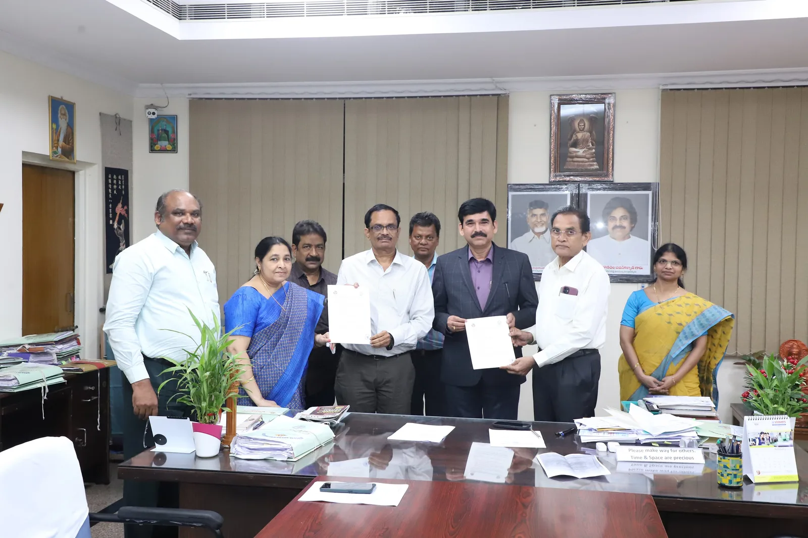 Acharya Nagarjuna University and NIFS officials holding agreement documents